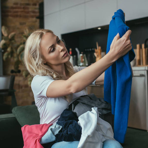 stock-photo-young-housewife-looking-pullover-while.jpg